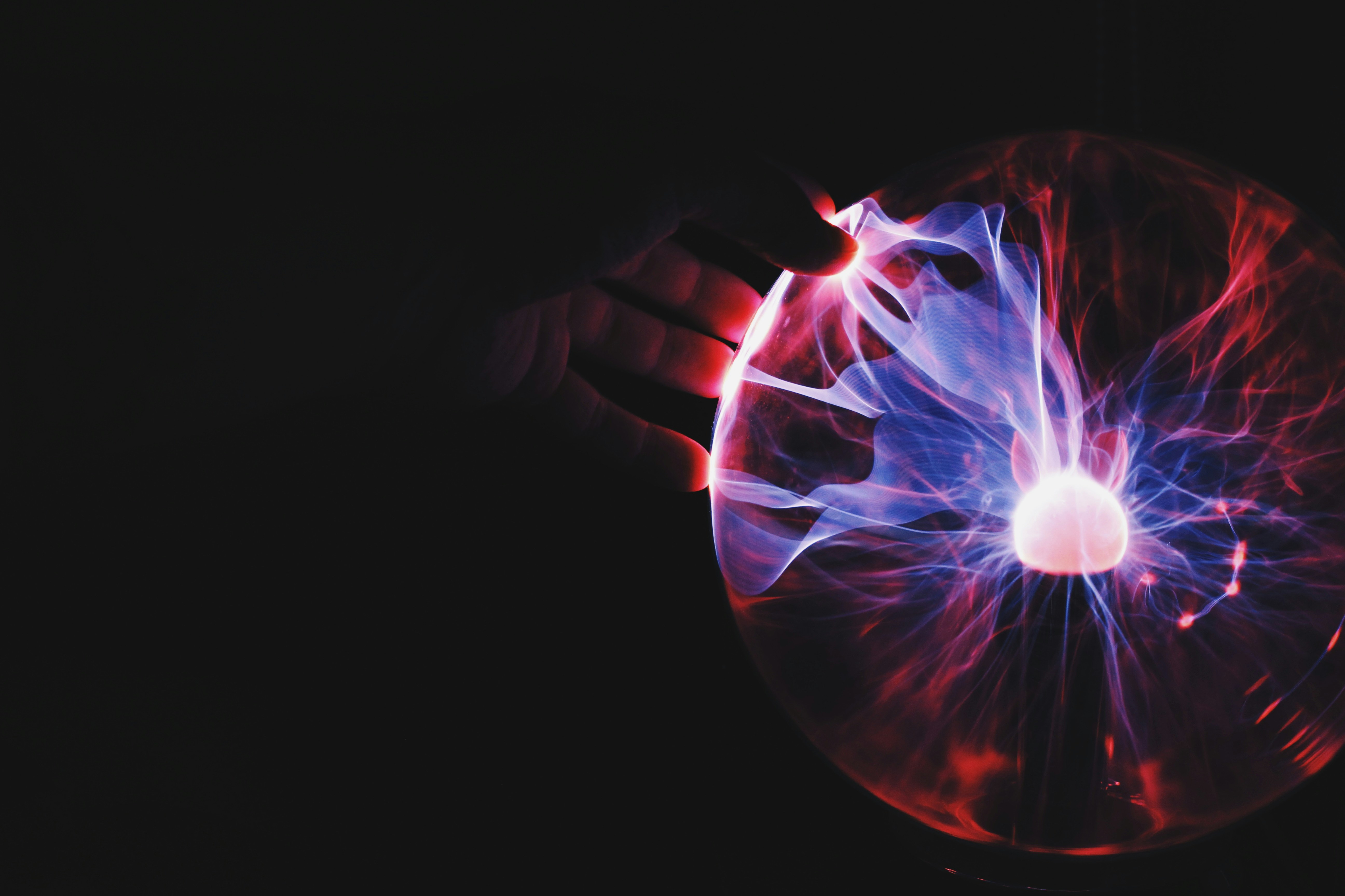 Hand holding plasma ball Website Header 